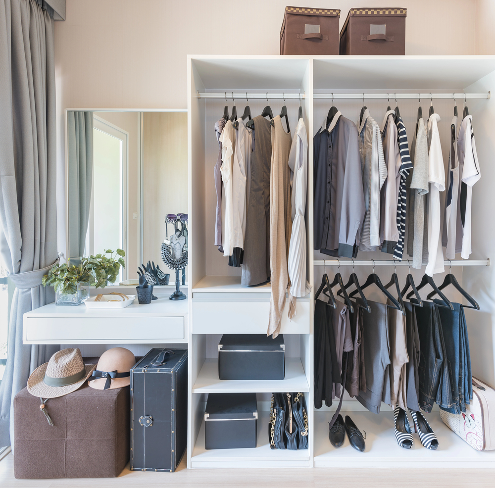 A closet from Artisan Bespoke Closets with reach-in closet systems.