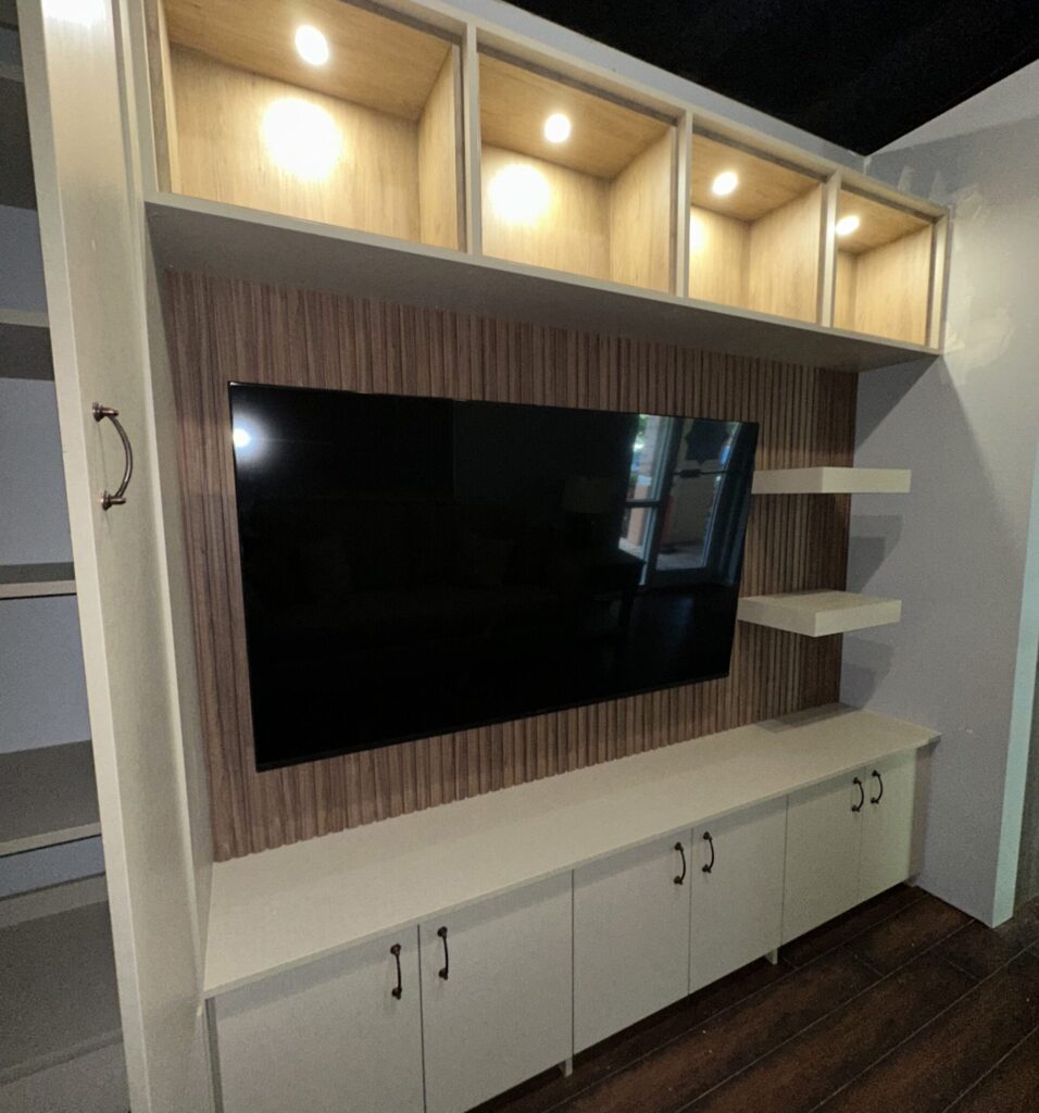 A home with a closet entertainment center in living area.