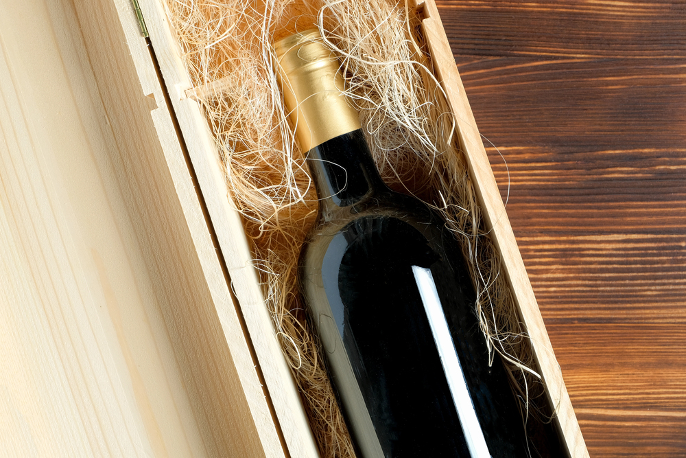 A wine bottle in a case from an under-stairs wine storage.