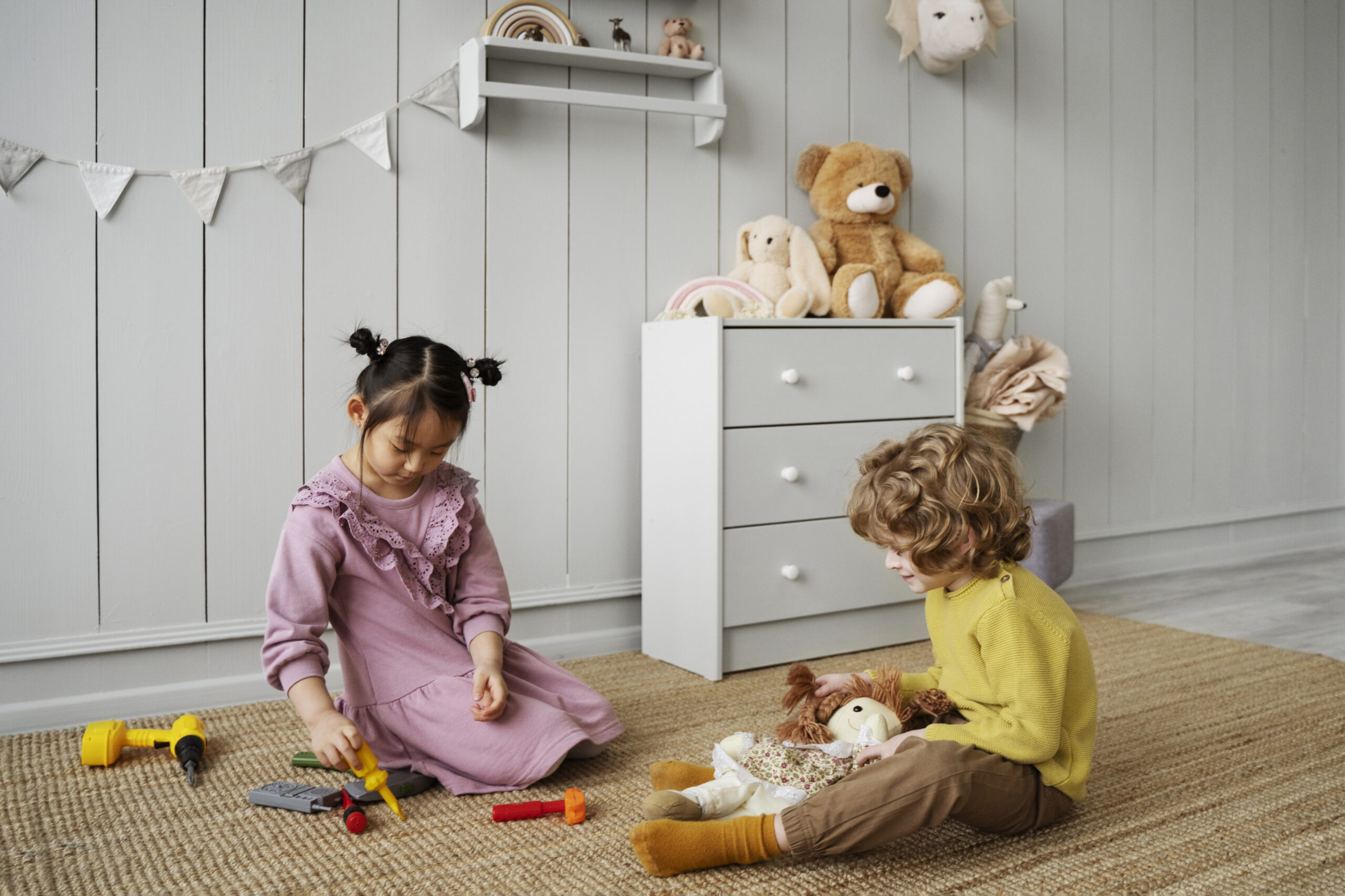 Kids playing around their children's playroom furniture