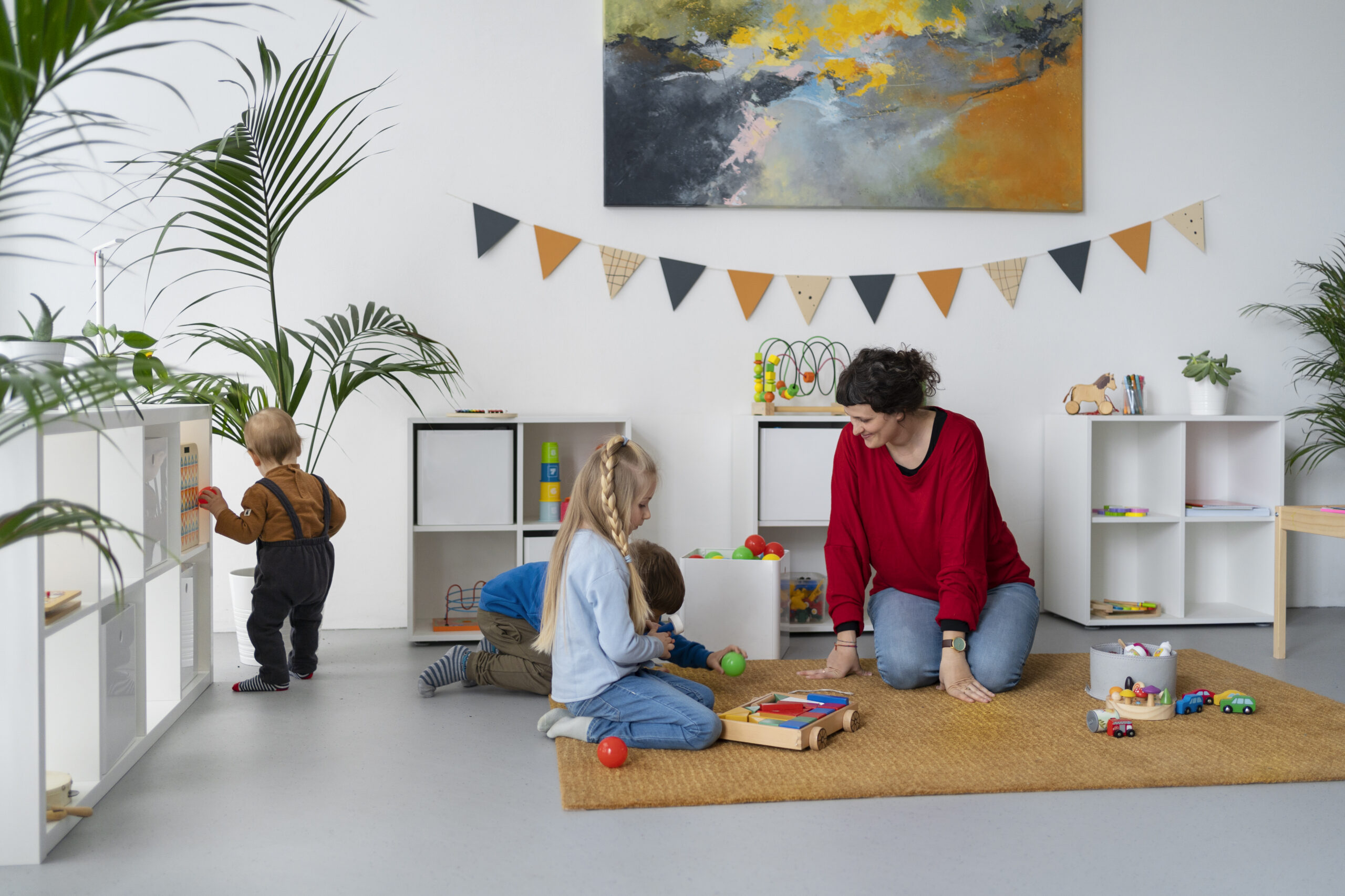 Children playing near their children's playroom furniture.